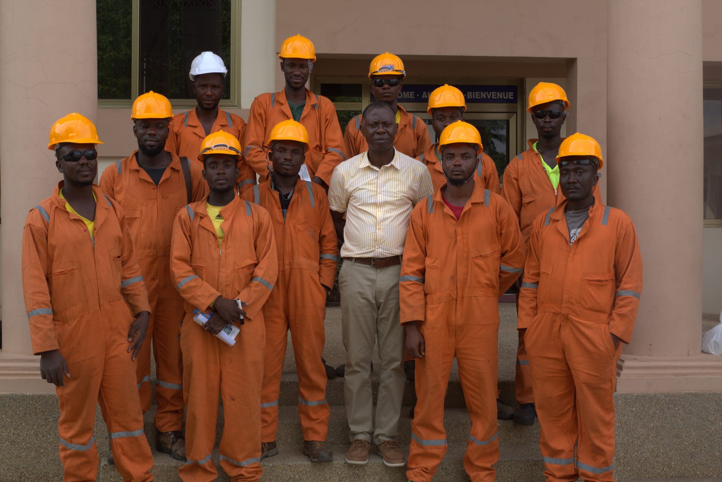 Adzepa EPC field team in orange coveralls and hard hats